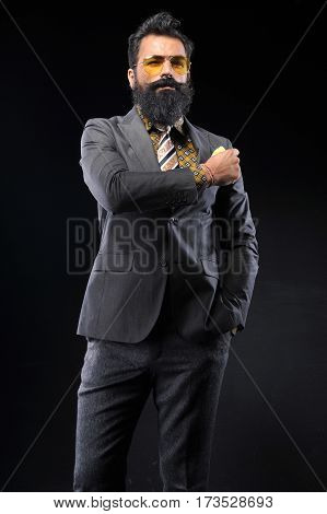 young handsome man wear gray suit on black background