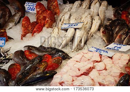 Fresh fish for sale on a market stall along an alleyway in the city centre Heraklion Crete Greece Europe.
