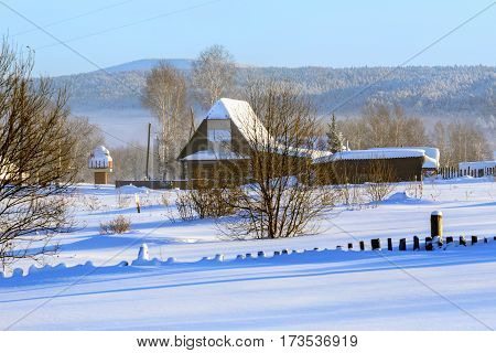 Early winter morning in Russian old-believer village Visim situated in the low Middle Ural Mountains of Sverdlovsk region, Russia