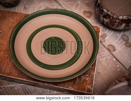 closeup handmade clay object in wooden table