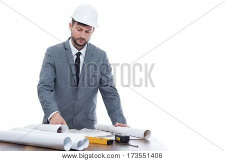 Project upgrade. Monochrome shot of a handsome mature male professional architect working on his building project copyspace isolated on white profession developer industry business building concept