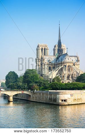 View of southern facade of Notre Dame de Paris from the Seine river. Notre Dame cathedral is a medieval catholic cathedral and finest example of french gothic architecture. Paris France.