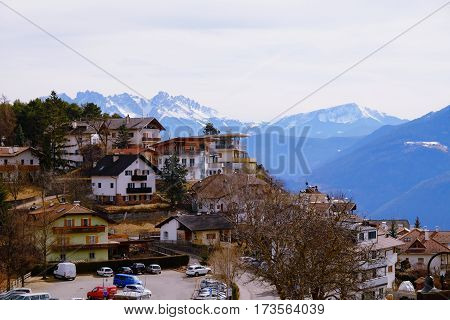 Village Jenesien with mountains Dolomites on the background. South Tyrol Italy - 26.02.2017.