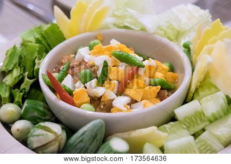 Naam Prik Long Rau chilli dip with pork and egg yolk Thai cuisine