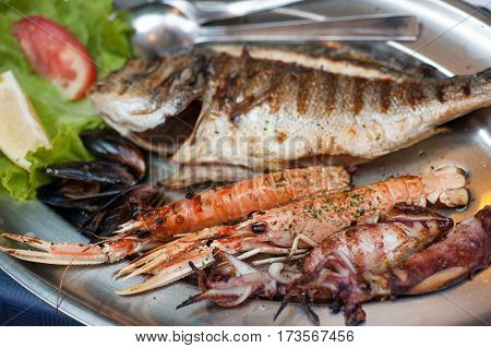 Hearty plate of various grilled seafood in Dubrovnic restaurant, Croatia