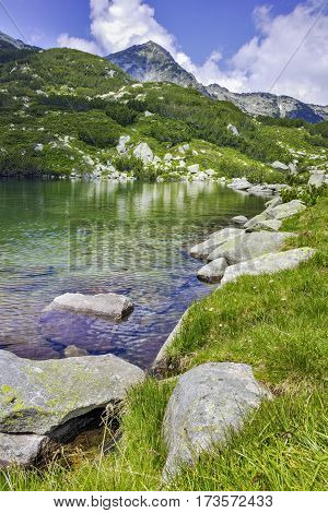 Landscape with Reflection of Muratov peak in river,  Pirin Mountain, Bulgaria