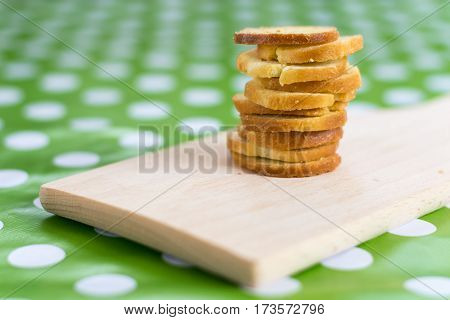 Pile Of Bruscettas Bread On The Wooden Board