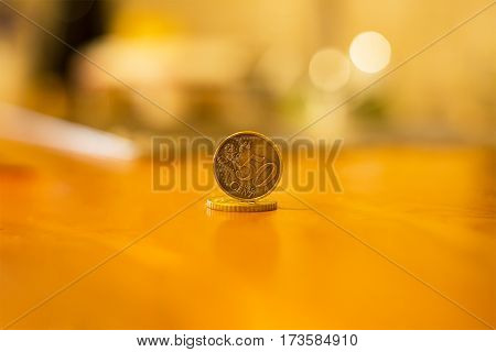 fifty euro cents coin golden coin worth one edge on the surface of another coins closeup