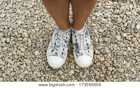 From where I stand ... pebblestones (feet, footwear)