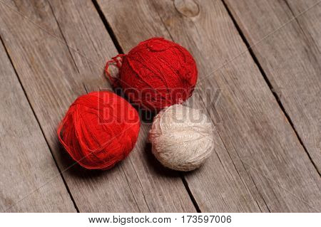 Different Balls Of Yarn On Rastic Background