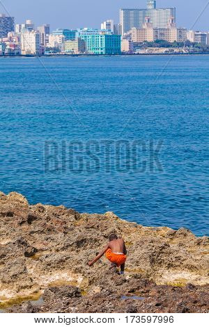 Havana, Cuba - April 1, 2012: Native Boy And Modern District Vedado