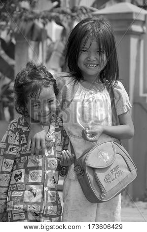 PHNOM PHEN, CAMBODIA MARCH 23: Unidentified street children posing on march 23 2013 in Phnom Phen,Cambodia.In Phnom Penh alone there are between 10,000 and 20,000 children live and work on the streets