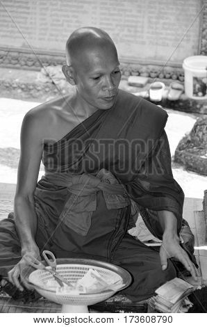 PHNOM KULEN CAMBODIA MARCH 27: Monk in Wat Preah Ang Thom on march 27 2013 in Phnom Kulen Camodia. Buddhism is the faith of 96% of Cambodians.