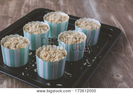 Making Muffins, Adding Streusel To The Pastry