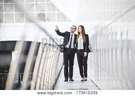 Businessman And Businesswomen having informal meeting in office and discussing plans in office