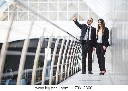 Businessman And Businesswomen having informal meeting in office and discussing plans