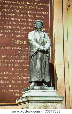 STOCKHOLM SWEDEN - AUGUST 19 2016: Statue of the writer Olaus Petri in Storkyrkan on Gamla stan statue by the Swedish sculptor Theodor Lundberg in 1898. in Stockholm Sweden on August 19 2016.