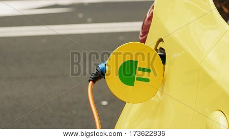 Power supply for electric car charging. City electric car charging station. Close-up.