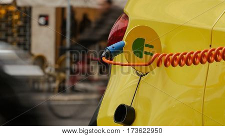 Power supply for electric car charging. City electric car charging station. Close-up.