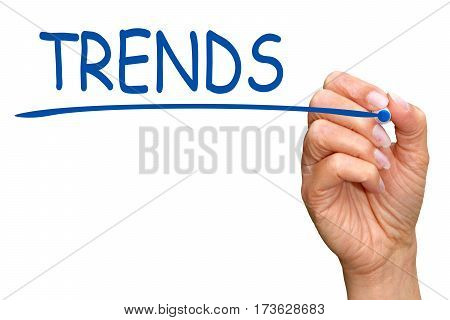 Trends - female hand writing text on white background