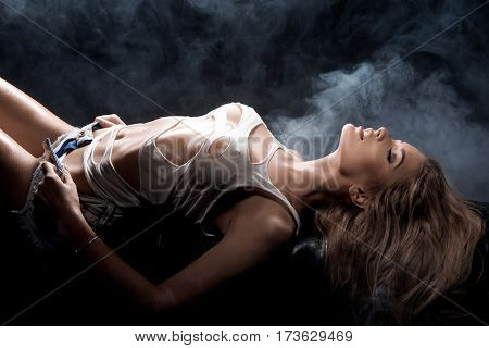 Beauty portrait of sensual blonde woman lying on bed.