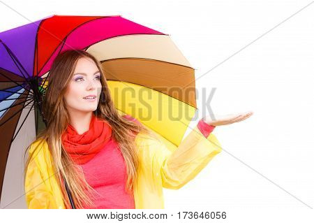 Woman In Rainproof Coat Under Umbrella
