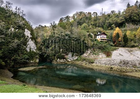 A beautiful waterfall in the heart of the gorges of Kakuetta in the Pyrénées Atlantiques. A little away from the path since it will be necessary to go under a bridge to see it from this angle of view.