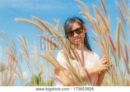 Girl And Feather Pennisetum