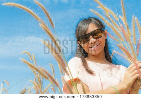 Girl And Feather Pennisetum