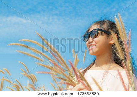 Girl And Feather Pennisetum