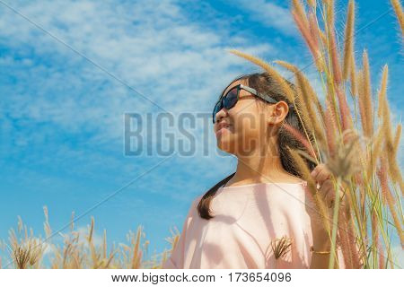 Girl And Feather Pennisetum