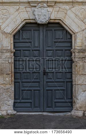 Front Door to Old Spanish Mission through stone wall