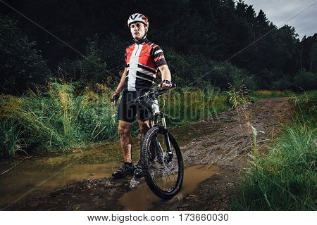 The young man cycling Cross-country in outdoor