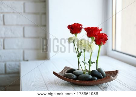 Flower arrangement on windowsill