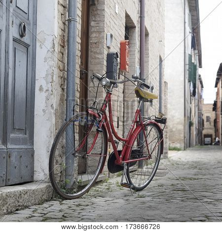 Urbania, Italy - August, 1, 2016: bicycle on a street in an ancient part of Urbania, Italy 
