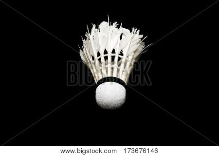 Bad condition badminton ball isolated on black background