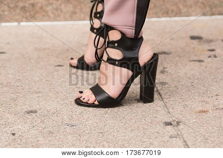 MILAN ITALY - FEBRUARY 23: Detail of shoes outside Genny fashion show during Milan Women's Fashion Week on FEBRUARY 23 2017 in Milan.