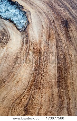 background wood surface with a wavy pattern decorated glass