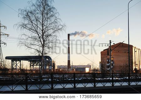 the thick smoke belching from factory chimneys