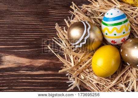 Colorful easter edds on a brown wooden table