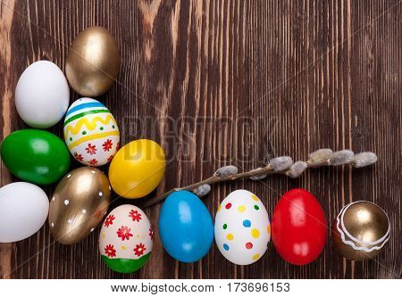 Colorful easter edds on a brown wooden table