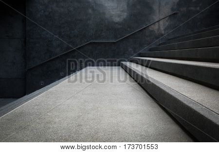 Perspective of the staircase and railing on concrete or marble walls for background.