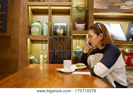 HONG KONG - CIRCA NOVEMBER, 2016: indoor portrait of a woman at Passion by Gerard Dubois in Hong Kong
