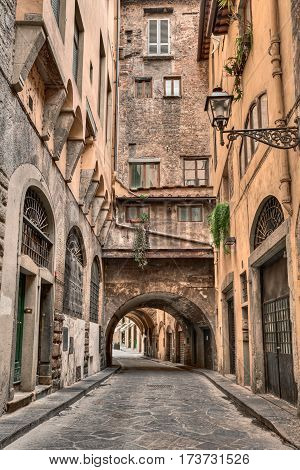 Florence, Tuscany, Italy: old narrow alley with underpass in the old town
