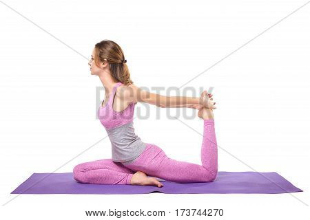 Attractive young sporty girl practicing yoga postures. White background.