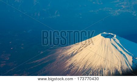 Beautiful Fuji Mountain viewed from airplane in early winter season.