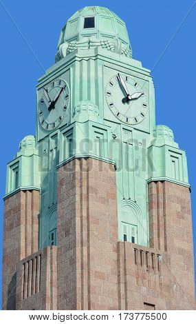 HELSINKI FINLAND SEPTEMBER 25 2015: Clock tower at the Helsinki Central railway station is a widely recognised landmark in Kluuvi, part of central Helsinki
