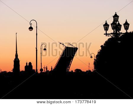 Saint-Petersburg, Russia. White Nights, silhouette Peter and Paul Fortress and divorced bridges.
