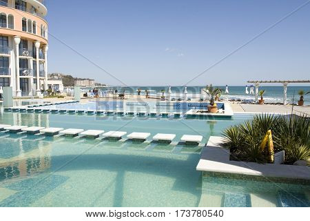 SAINT CONSTANTINE AND HELENA BULGARIA - APRIL 10 2015: swimming pool and beach of hotel Azalia in Saint Constantine and Helena is the oldest first sea resort of Bulgaria exists from 19 century.