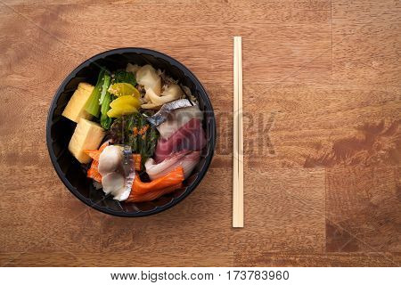 Japanese Food Tekka Don Take Away On Wooden Background
